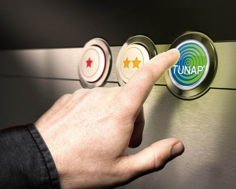 TUNAP Solutions Hand pointing at a button with TUNAP writing